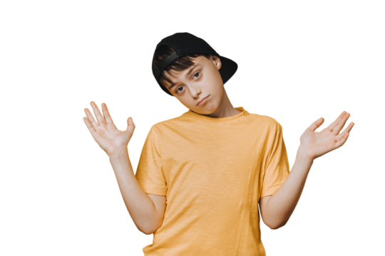Indifferent schoolboy Bored handsome young boy dressed in yellow t-shirt and baseball cap spreads his hands out, being in doubt. Mockup on transparent background with copy space. Teen hesitating