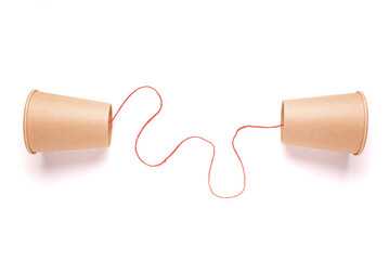 Old style cup phone with red string on white background, two way communication, information...