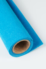 Soft felt textile material Blue colors, colorful texture fabric roll closeup