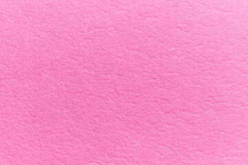 Soft felt textile material pink color, colorful texture flap fabric background closeup