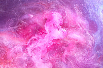Gentle Pink abstract ocean background. Splashes, drops and waves of paint under water, clouds of smoke in motion