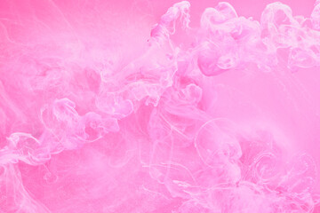 Fototapeta premium Gentle Pink abstract ocean background. Splashes, drops and waves of paint under water, clouds of smoke in motion