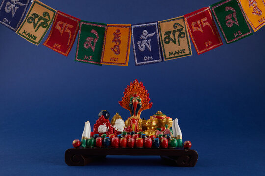 Happy Losar, Tibetan New Year background. Text on flags Om mani padme hum meaning The jewel is in the lotus