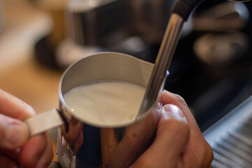 Milk being warmed in a coffee machine