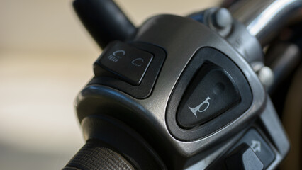 White horn symbol on motorcycle parts.