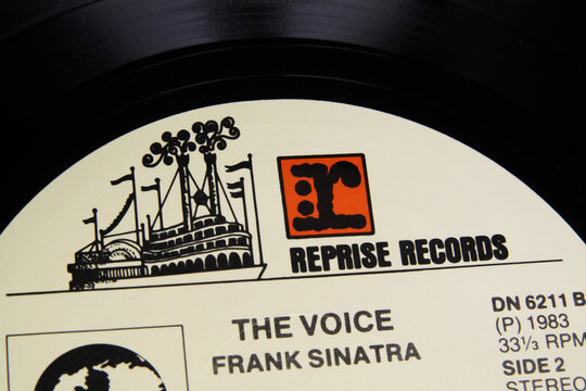 Viersen, Germany - 8. June 2022: Closeup of vinyl record label with logo lettering of Reprise records