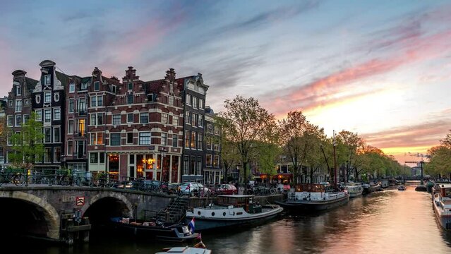 Amsterdam Netherlands time lapse 4K, city skyline sunset timelapse at canal waterfront