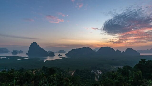 Tropical islands sunrise time lapse at Samed Nang Chee viewpoint with bay to sea ocean, Phang Nga Thailand nature landscape timelapse