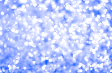 Bokeh background of Christmas sparkles. Blurred festive background. Beautiful Christmas decoration of the interior of the house.