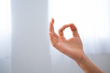 Closeup of hand on meditation position with copy space