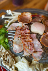 Wood Table with deliciouse seafood, shrimp, crab, mussle, pork saussage and vegetable in bbq grill restaurant from thailand