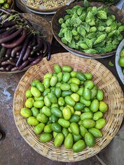 fresh lemon green lemon yellow in the bowl it is healthy food a lot of lemon green lime many lime background fruit Crop group of green fresh lemon nature food vitamin c good health