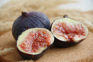 fresh figs cut on a wooden table