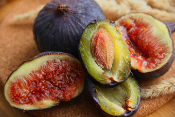 fresh figs and plum on a wooden table