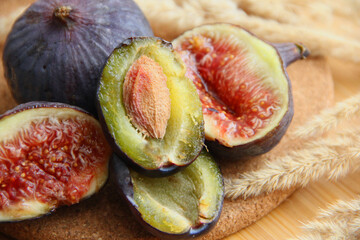 fresh figs and plum on a wooden table