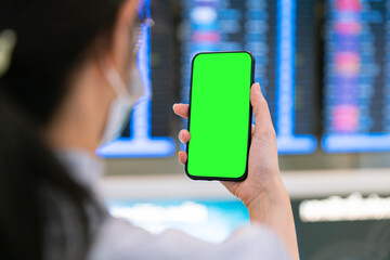 businesswoman check airplane plane flight on time board and phone and passport for travel flight to check-in for window seat and take off for business trip travel at airport