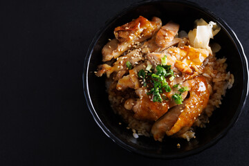 Grilled Chicken teriyaki rice Japanese food isolated in black background