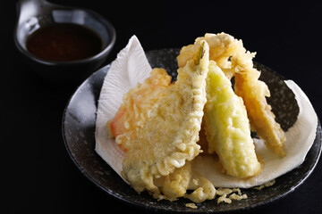 Mix tempura with shrimp fish and vegetable Japanese food isolated in black background