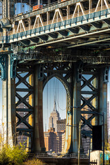 Brooklyn, New York, USA - April 25, 2022: View of Manhattan bridge from Dumbo district in Brooklyn....