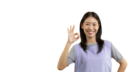 Young asian woman over PNG backgroung doing ok sign with hands, OK symbol, Welcome, Agree, Join, Do as instructed, Follow orders, Acceptance of all conditions.