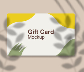 Realistic gift card mockup template design with shadow overlay.