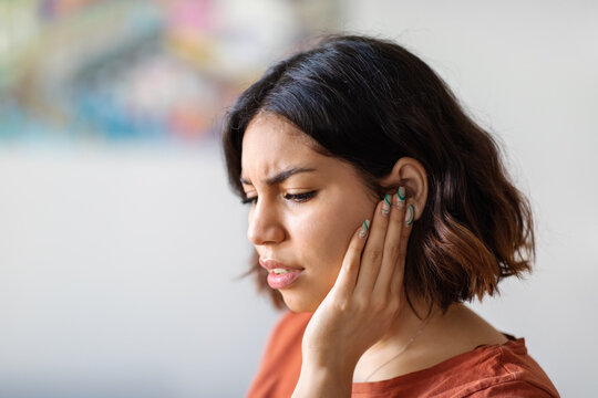 Ears Pain. Sick Young Arab Woman Suffering From Earache At Home