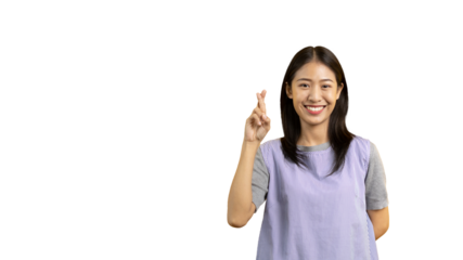Young Asian woman making a symbolic gesture with fingers crossed showing good luck, White lie gesture, Fingers crossed, Woman doing hand sign on PNG file, Superstitious concept.
