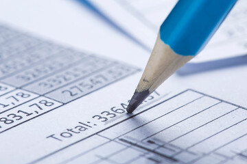 Checking the value of securities. Pencil, share listing and checking financial chart. Concept of banking, financial report and financial audit.