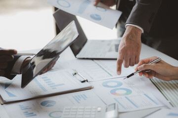 Business man group are meeting together in the office, they are meeting on the topic of finance and financial management, they are business partners. Concept financial management for startup companies