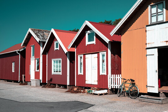 Colorful traditional fisherman huts, boathouses in row small harbor. Storage for fishing or rented as Holiday cottage