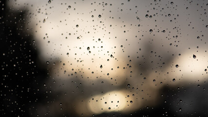 rain on window, sunset