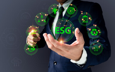 ESG-based investment business concept (environmental, social, and governance). Women use a digital tablet to analyze ESG while surrounded by ESG icons. in the concept of business investment strategy.