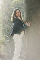 Fototapeta premium A woman on a walk in the forest in the Ukrainian Carpathians.