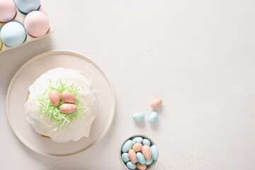 Traditional Easter cake and pink eggs on white background. Top view. Copy space. Happy Easter. Christian religion.