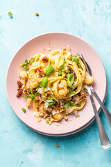 Tagliatelle pasta dish with cauliflower, sun dried tomatoes, basil, chiev, walnuts and parmesan...