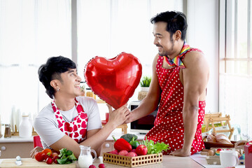 Happy smiling LGBT couple sharing special moment together on Valentine Day, Asian gay male lover...