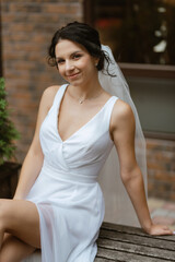 Naklejka premium preparations for the bride with the dressing of the wedding dress
