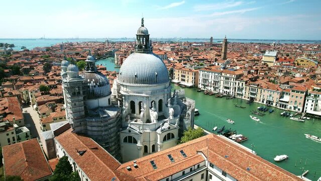 Drone Venice Italy 4k. Salute Basilica church, old architecture on Grand canal. Romantic honeymoon tourism landmark in Italy. Famous cruise destination in Europe. 