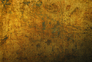 Dark golden abstract background with scuffs and scratches. Metal texture with rust