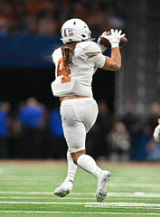 Football player making great play during competitive games