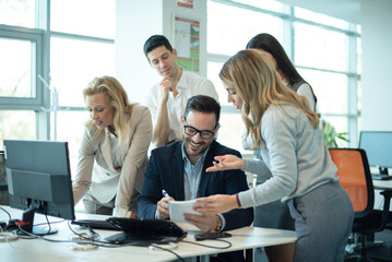 Group of confidence business people working together, discussing and sharing ideas consider strategy, develop start up, plan work at workplace in the office.