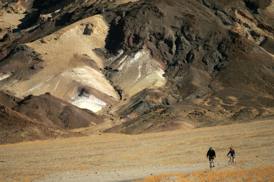 Two mountain bikers in Death Valley, California.