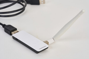 USB network adapter with USB extension cable isolated on white 