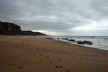Beautiful and wild beach with waves on the coast of Portugal