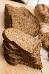 fresh loaf of bread on wooden board