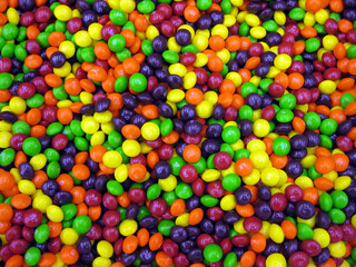 Fototapeta na wymiar Colorful and crunchy candy-coated chocolate candies.