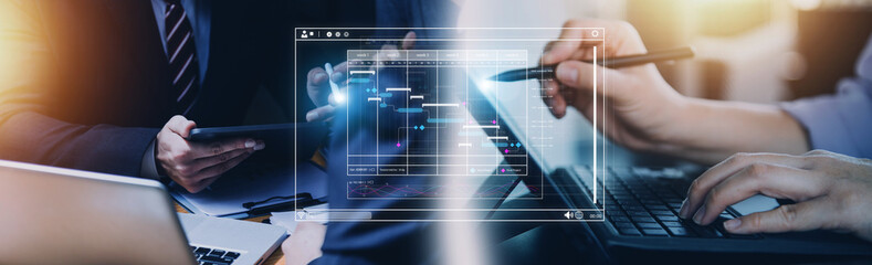 Analyst working with computer in Business Analytics and Data Management System to make report with KPI and metrics connected to database. Corporate strategy for finance, operations, sales, marketing