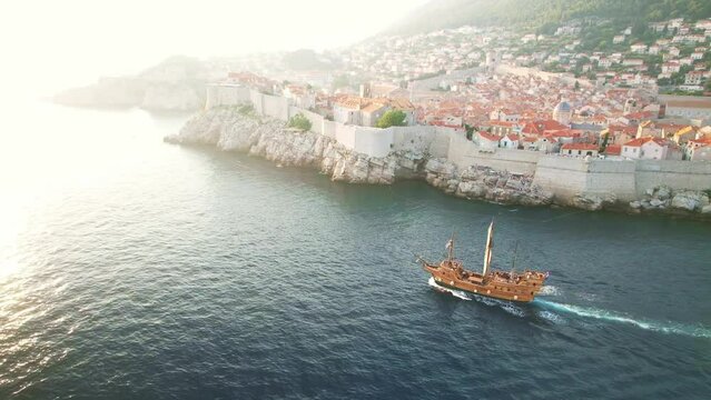 Drone view Dubrovnik. historic sail ship near Dubrovnik Old Town fortress, Croatia. Travel destination for tourist visiting Croatia. Europe summer tourism.