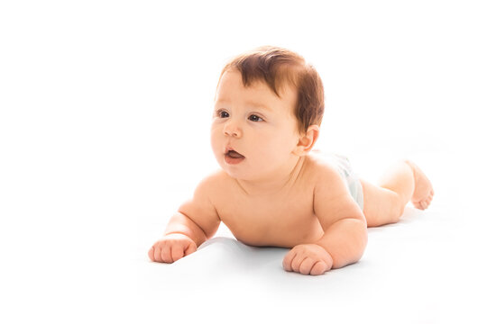 a beautiful baby lying on a white background