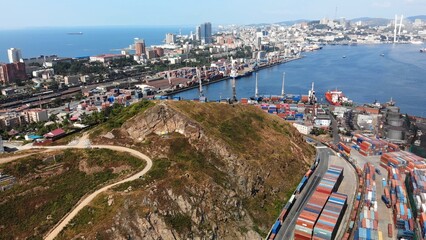 Obraz premium Cross Hill in Vladivostok. Aerial view. Cross at the top of Krestovaya hill and panorama of the Golden Horn bay and the city center.